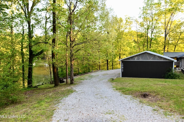 view of street featuring gravel driveway