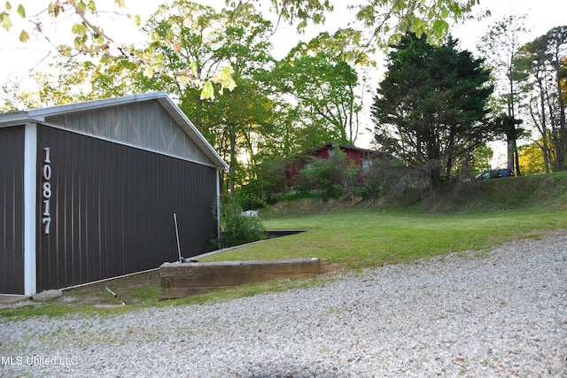 exterior space with an outbuilding and a yard