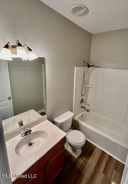 full bathroom featuring vanity, toilet, shower / bathing tub combination, and wood-type flooring