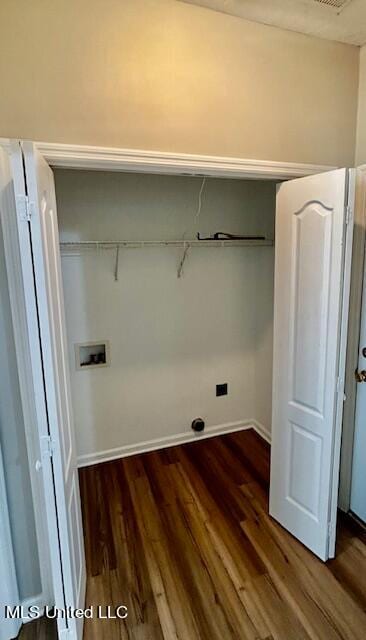 clothes washing area featuring dark wood-type flooring and washer hookup