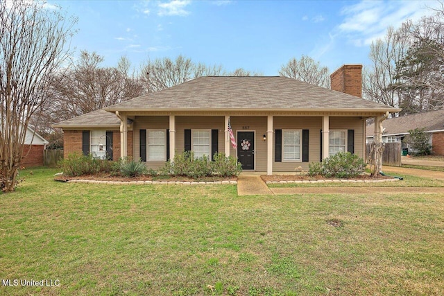 view of front of house with covered porch and a front lawn