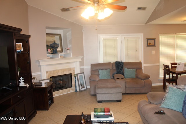 100 Roseleigh Cv, Batesville, MS 38606 - living room with ceiling fan, vaulted ceiling, a fireplace, and light tile patterned floors