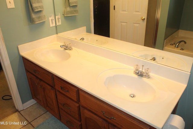 100 Roseleigh Cv, Batesville, MS 38606 - bathroom with double vanity, a bath, and tile patterned flooring