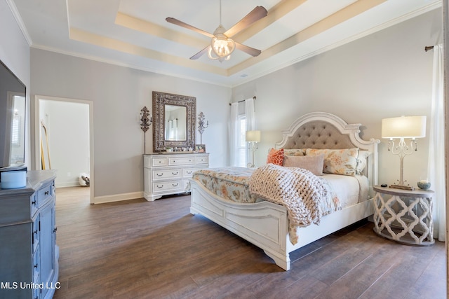 bedroom featuring a tray ceiling, ceiling fan, and dark wood-type flooring