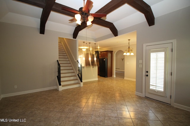 unfurnished living room featuring beamed ceiling, light tile patterned floors, and ceiling fan with notable chandelier