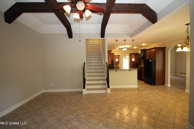 unfurnished living room with ceiling fan, beamed ceiling, and light tile patterned flooring