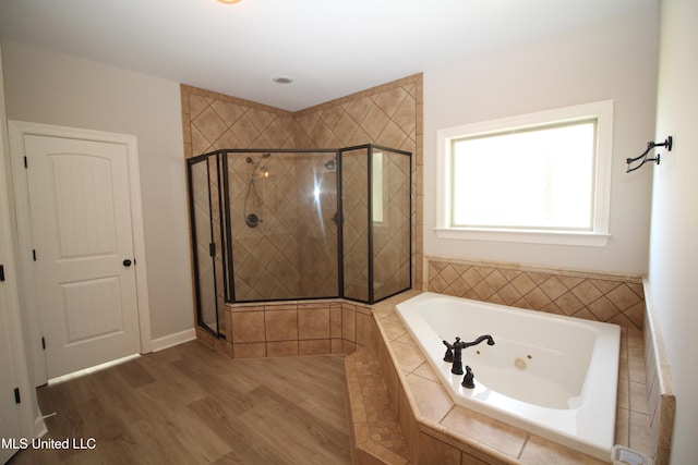 bathroom with hardwood / wood-style flooring and plus walk in shower