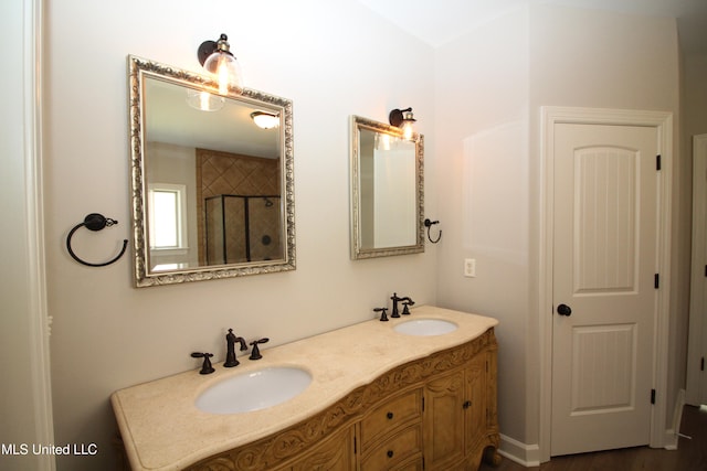 bathroom featuring vanity, a shower with shower door, and hardwood / wood-style floors