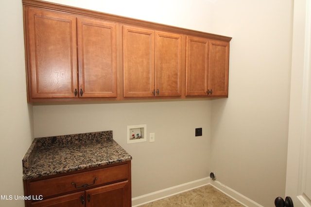 laundry room featuring cabinets, hookup for an electric dryer, and washer hookup