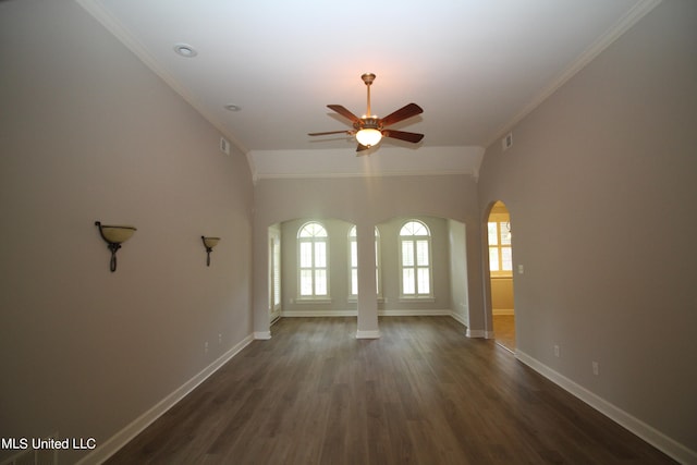 spare room featuring ornamental molding, ceiling fan, and dark hardwood / wood-style flooring