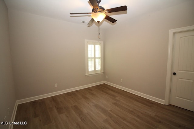 unfurnished room featuring dark hardwood / wood-style floors and ceiling fan