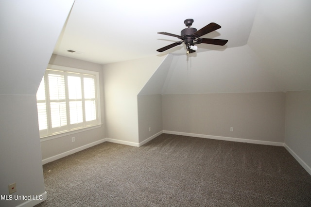 additional living space with lofted ceiling, carpet, and ceiling fan