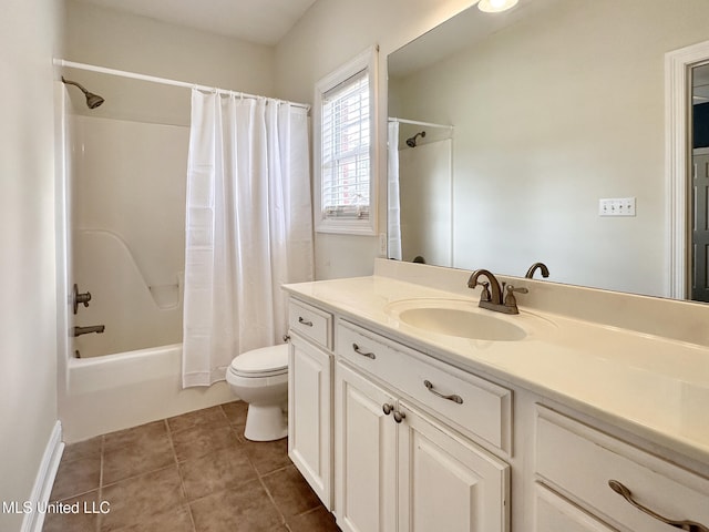 full bath featuring tile patterned flooring, toilet, vanity, and shower / bathtub combination with curtain