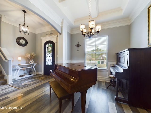 miscellaneous room featuring crown molding, dark hardwood / wood-style floors, and a notable chandelier