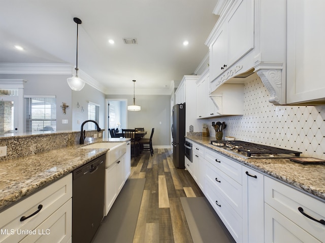 kitchen featuring light stone countertops, ornamental molding, black appliances, pendant lighting, and white cabinetry