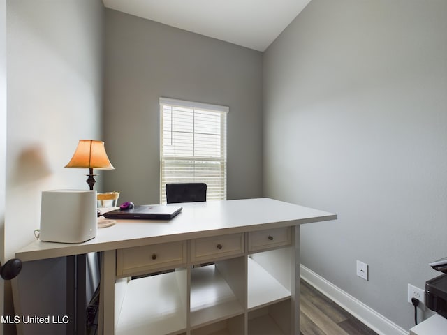 office with dark hardwood / wood-style flooring