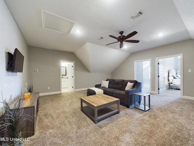 living room with ceiling fan, light colored carpet, and vaulted ceiling