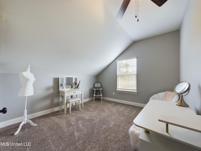 carpeted office space with ceiling fan and lofted ceiling