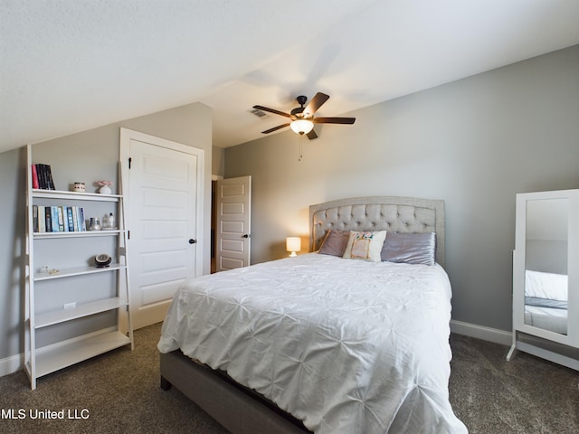 carpeted bedroom with ceiling fan and vaulted ceiling