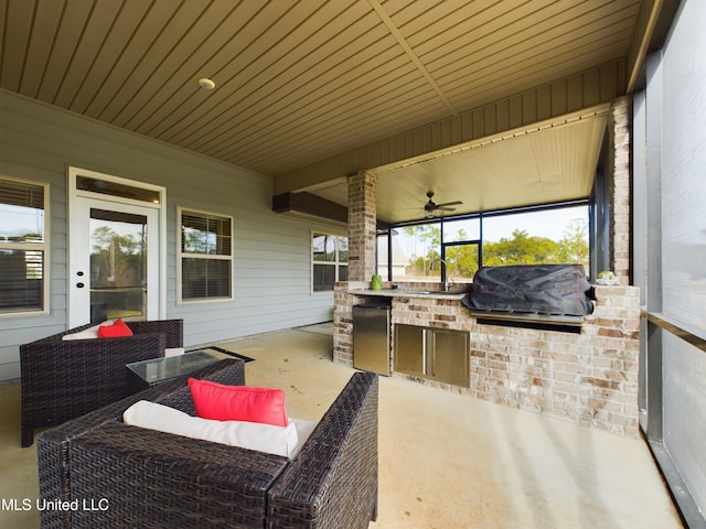 view of patio / terrace with outdoor lounge area, ceiling fan, sink, a grill, and area for grilling