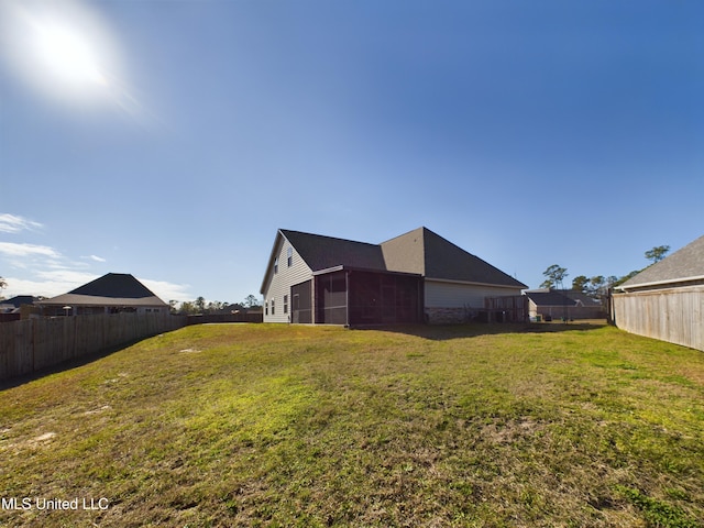 view of yard with a sunroom