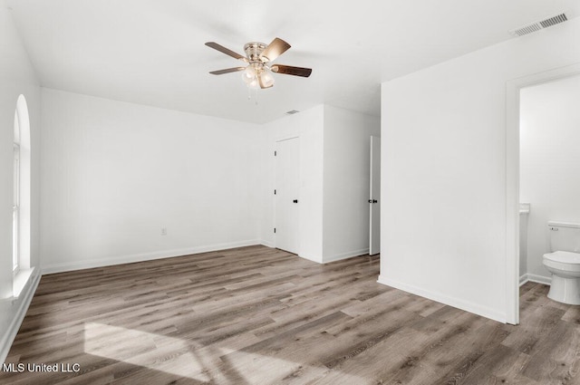 spare room featuring light hardwood / wood-style flooring and ceiling fan