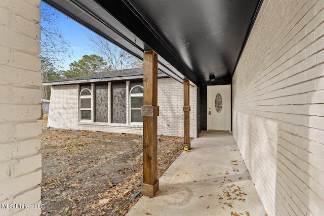 view of side of home featuring a patio area