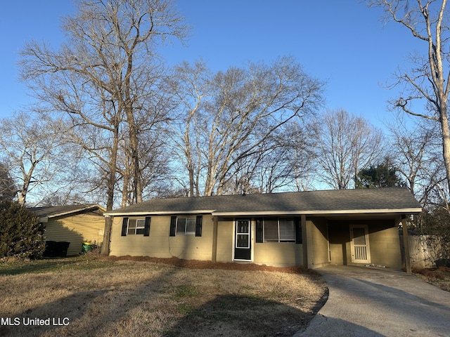 ranch-style home featuring a carport