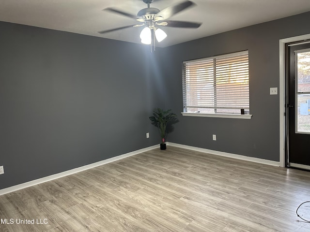 spare room with ceiling fan and light hardwood / wood-style flooring