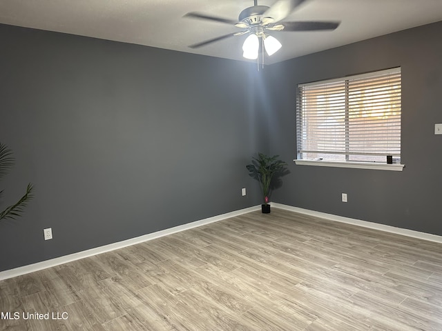 unfurnished room featuring ceiling fan and light hardwood / wood-style flooring