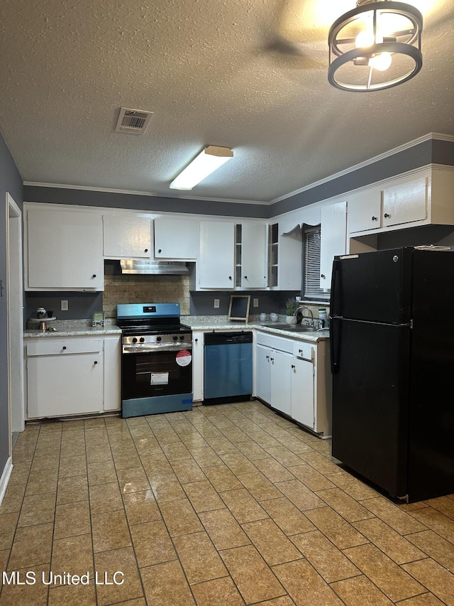 kitchen featuring tasteful backsplash, sink, white cabinets, stainless steel appliances, and a textured ceiling