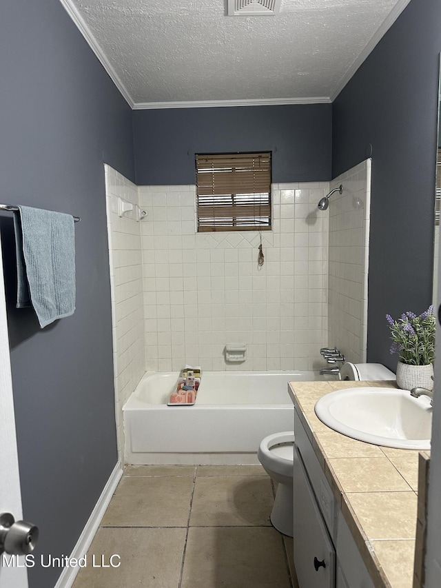 full bathroom featuring toilet, crown molding, a textured ceiling, vanity, and tiled shower / bath combo