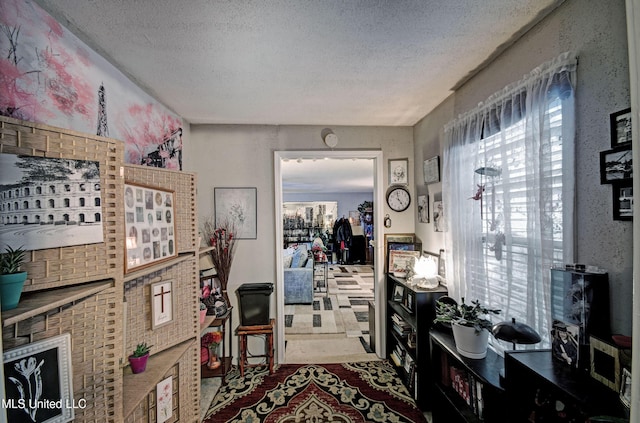 interior space featuring a textured ceiling