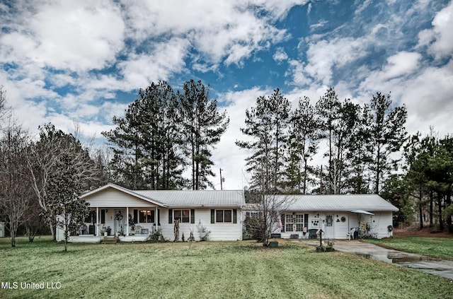 ranch-style home with a porch and a front lawn