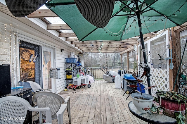 wooden deck with a pergola