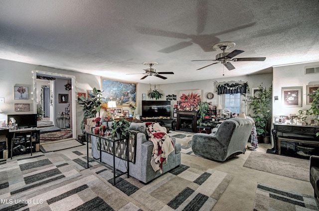 living room featuring light colored carpet and a textured ceiling