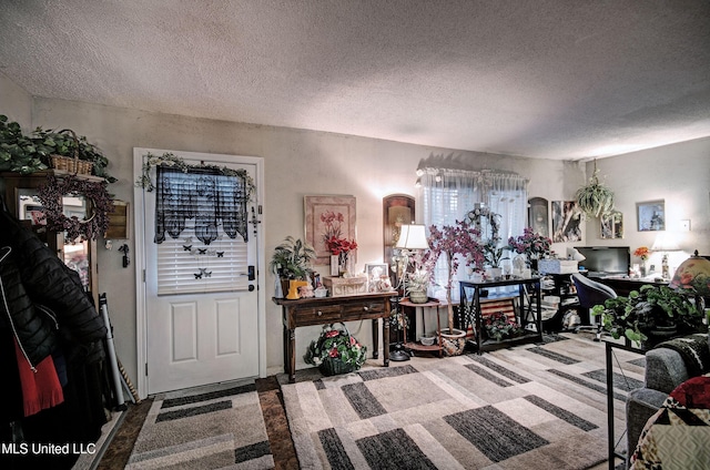 entryway featuring a textured ceiling