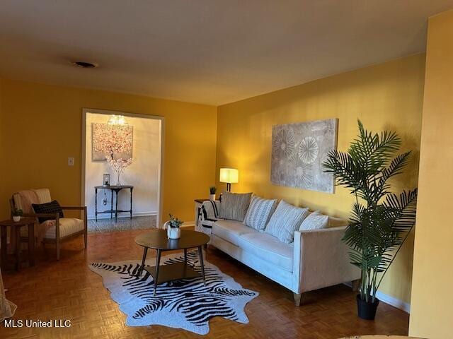 living room featuring dark parquet floors