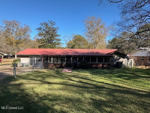 ranch-style home with a front yard