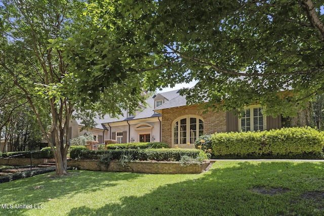 1 Cypress Ln, Jackson, MS 39211 - view of front of house featuring a front yard and a shingled roof