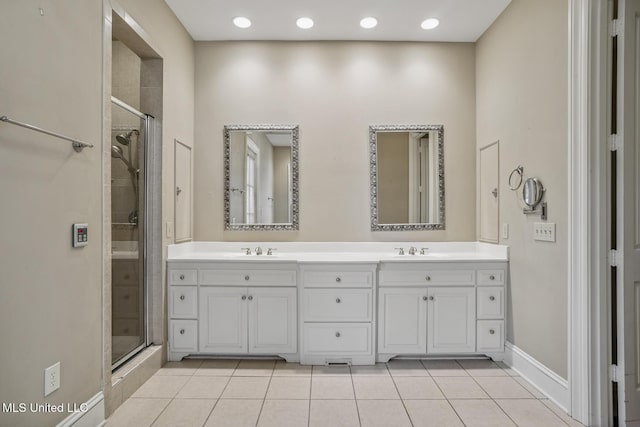 1 Cypress Ln, Jackson, MS 39211 - bathroom with double vanity, a shower stall, tile patterned floors, and recessed lighting