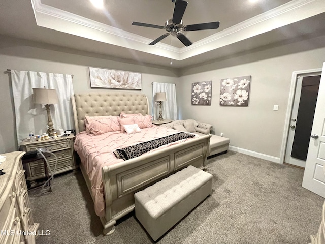 bedroom with baseboards, carpet floors, ornamental molding, and a raised ceiling