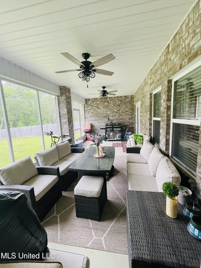 exterior space featuring an outdoor living space and a ceiling fan