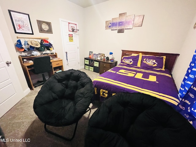 carpeted bedroom featuring baseboards