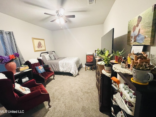 carpeted bedroom featuring visible vents and ceiling fan