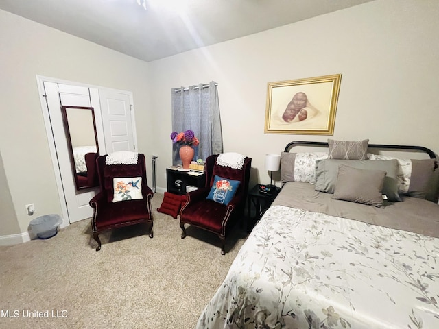 carpeted bedroom with baseboards