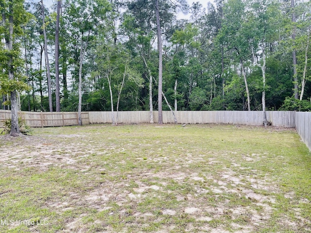 view of yard with a fenced backyard