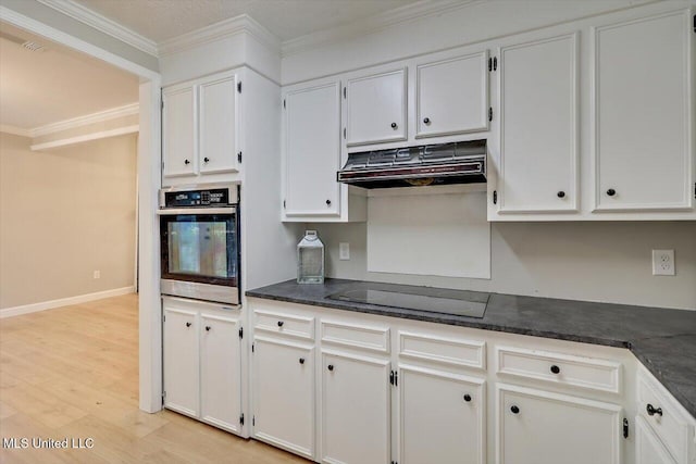 800 Longwood Pl, Clinton, MS 39056 - kitchen featuring oven, under cabinet range hood, black electric stovetop, dark countertops, and crown molding