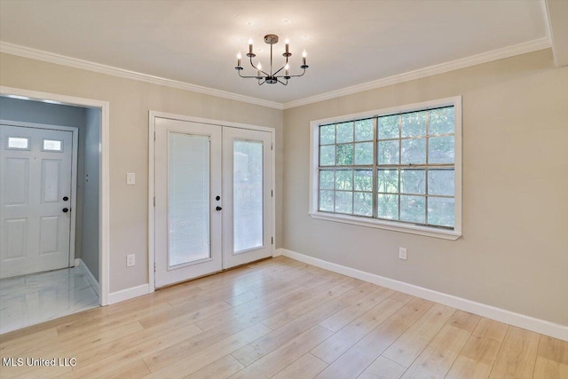 800 Longwood Pl, Clinton, MS 39056 - foyer entrance featuring french doors, a chandelier, baseboards, crown molding, and light wood-type flooring