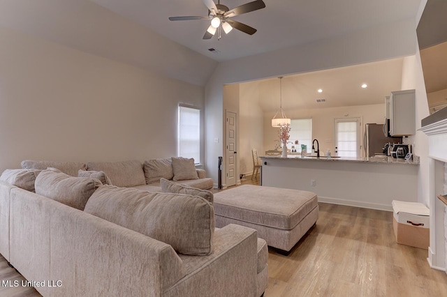 2561 Dela Dr, Southaven, MS 38672 - living area featuring a ceiling fan, vaulted ceiling, light wood-type flooring, baseboards, and recessed lighting